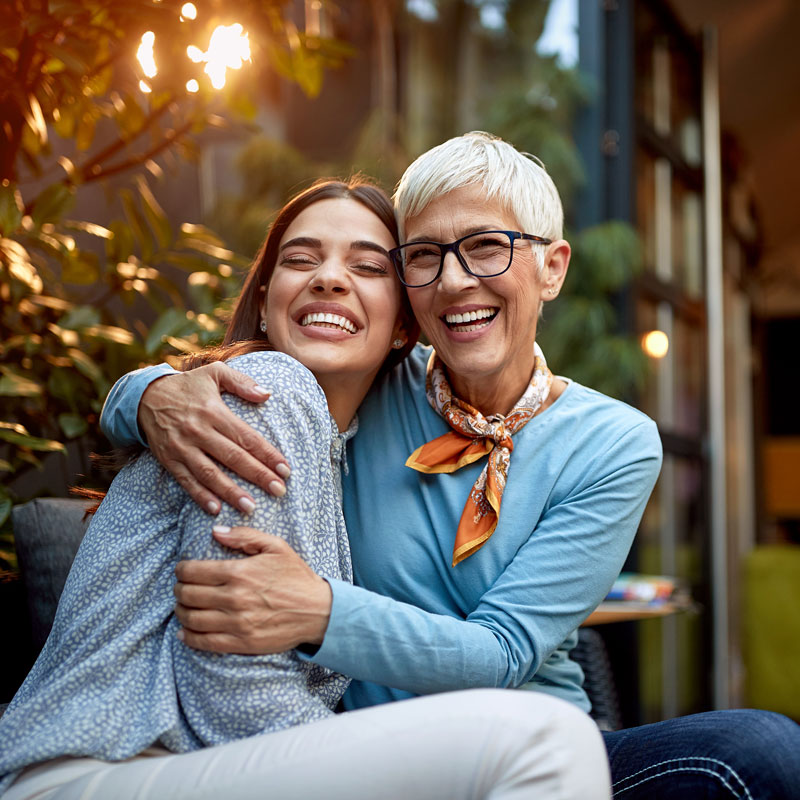 ladies hugging and smiling
